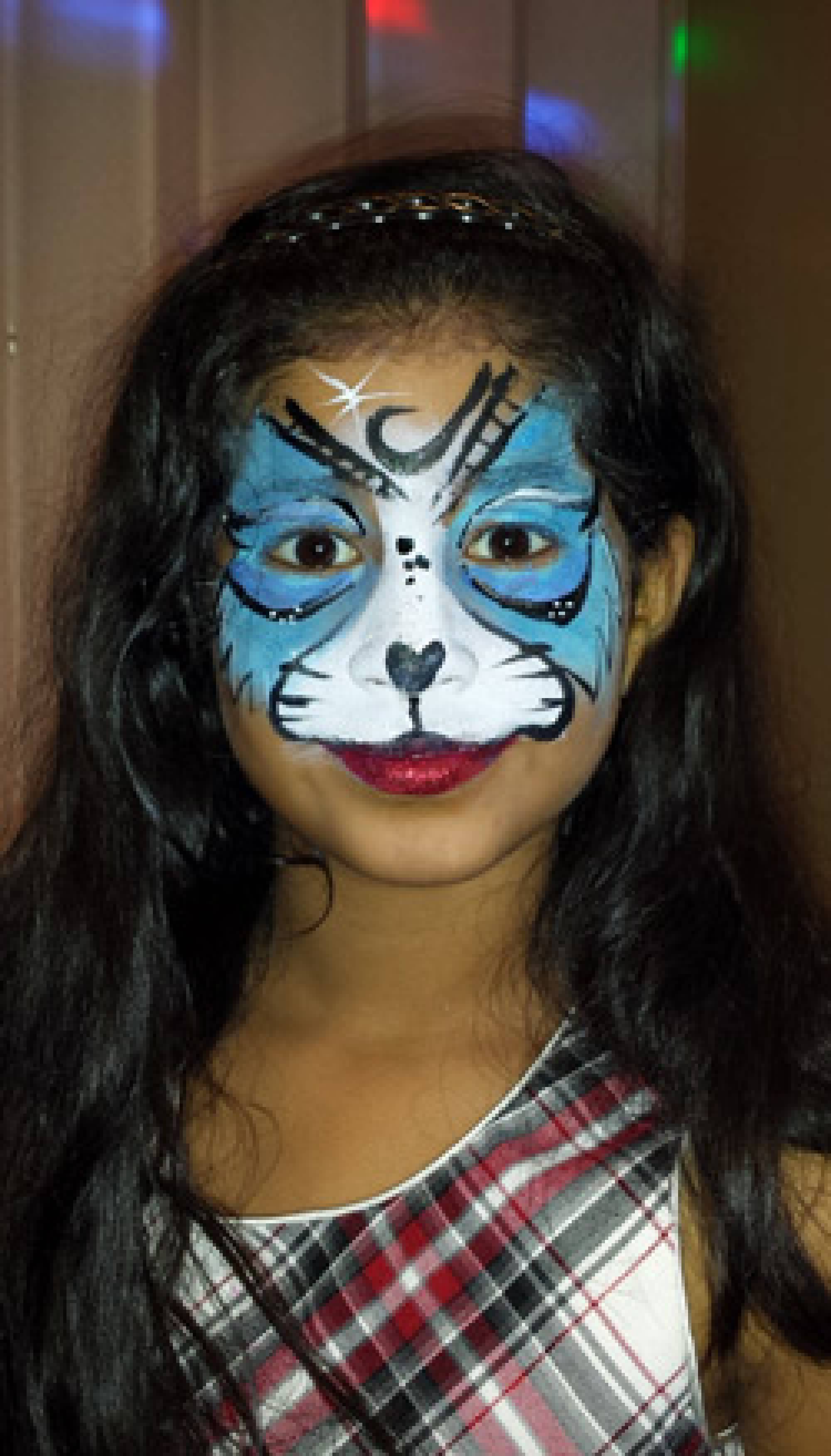 Blue feline face painting in Cary