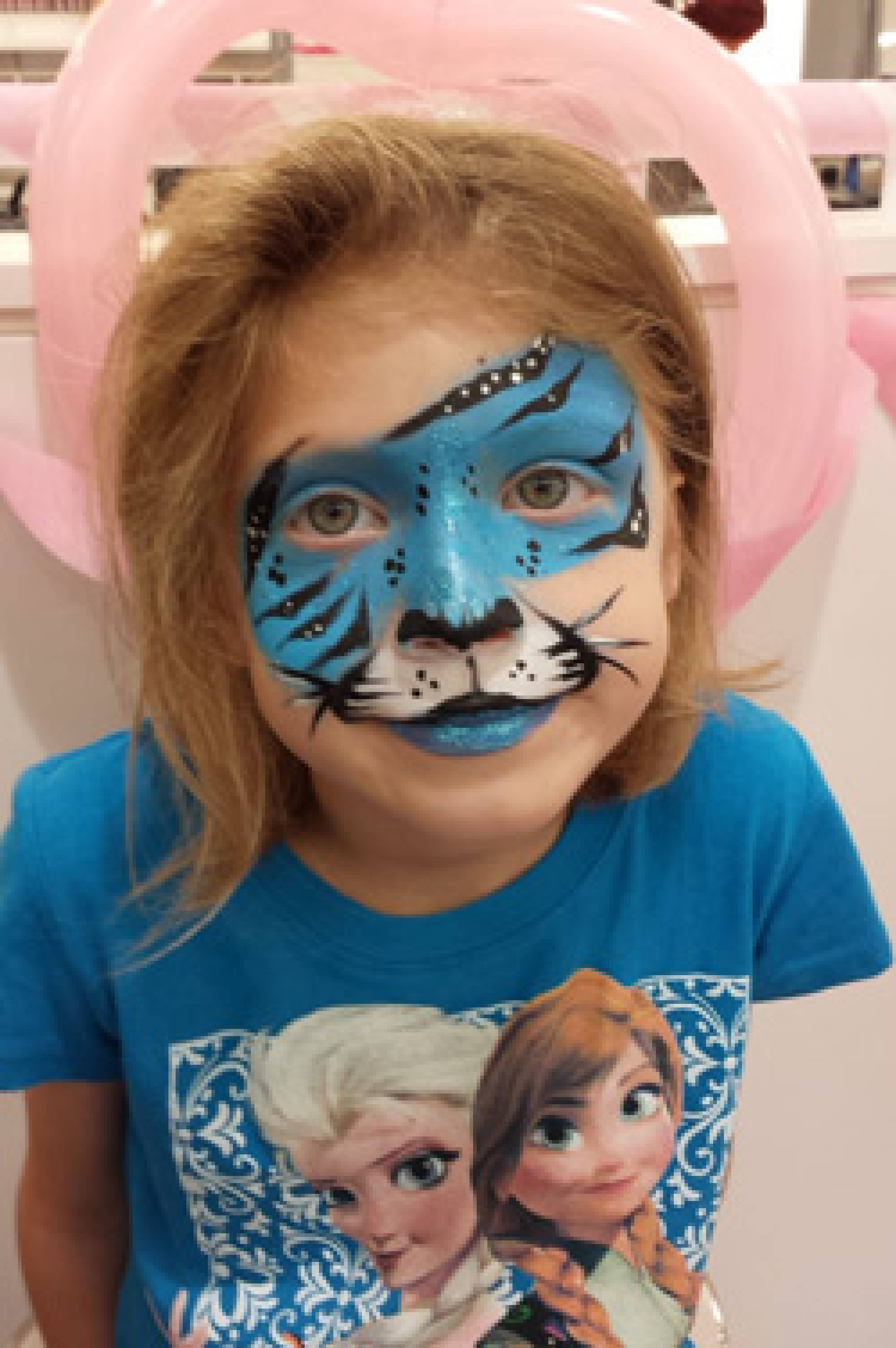 Pretty blue tiger face painting in Holly Springs