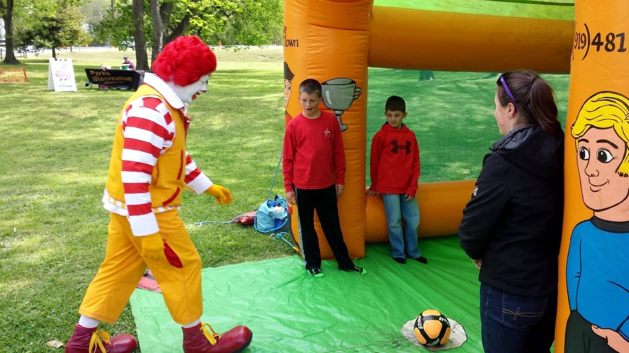 A famous clown tries his kicking skills on the Soccerama game rental