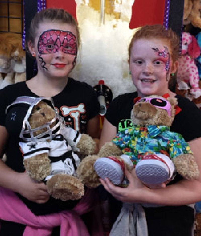 Face painting and stuffed animals at the NC State Fair