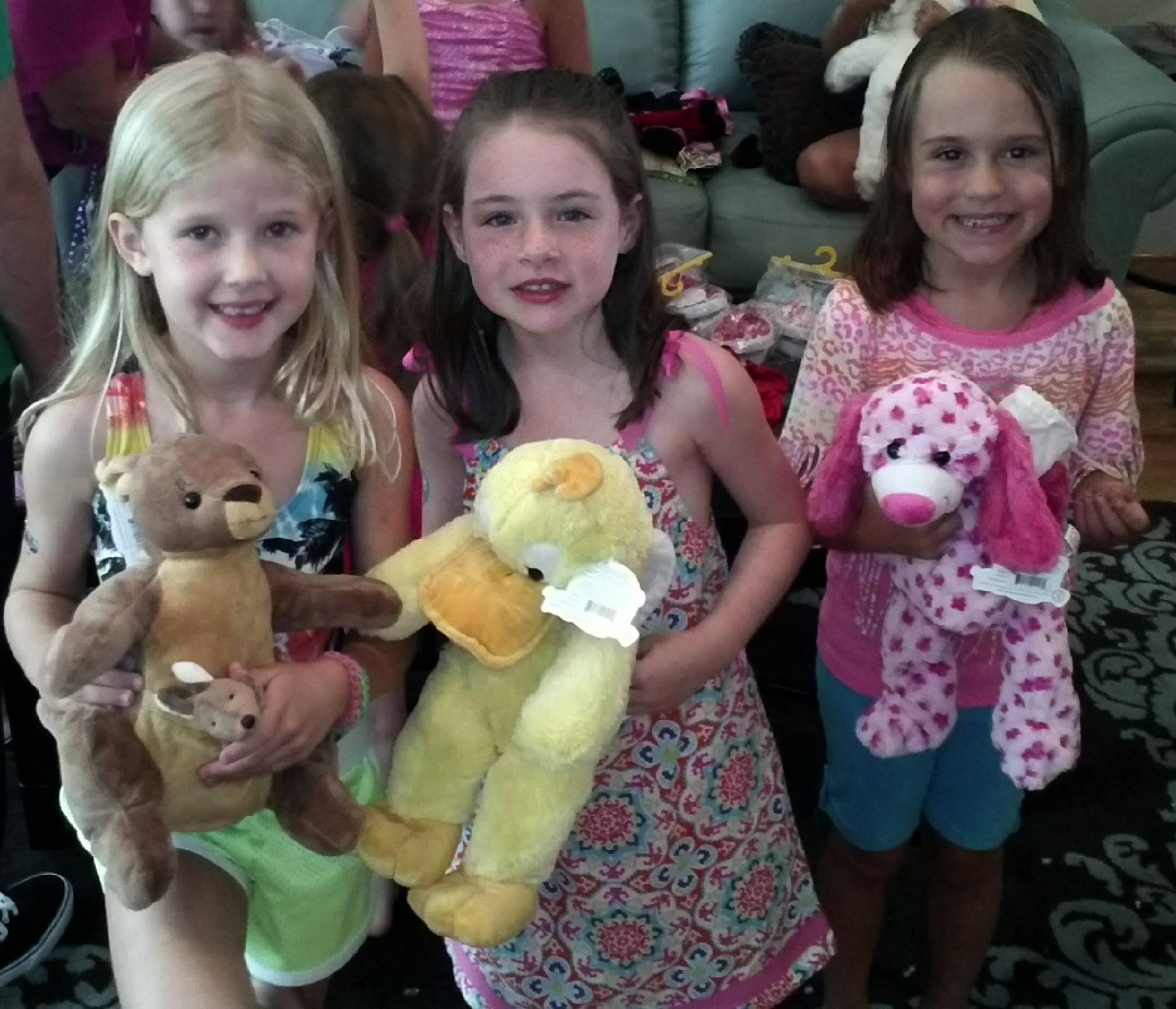 Happy girls with animals they stuffed themselves at Cary party