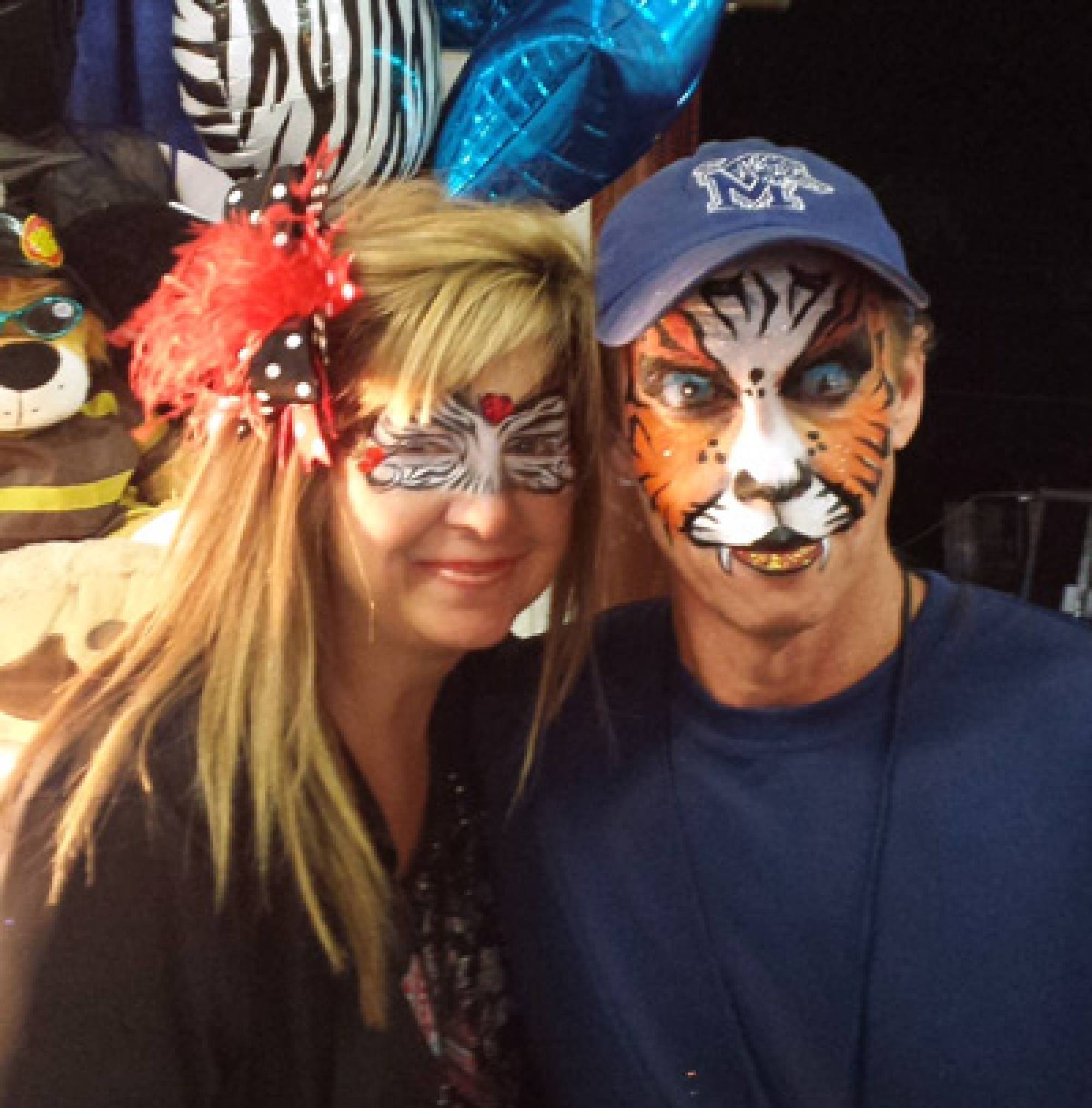 Zebra mask and tiger face painting at NC State Fair